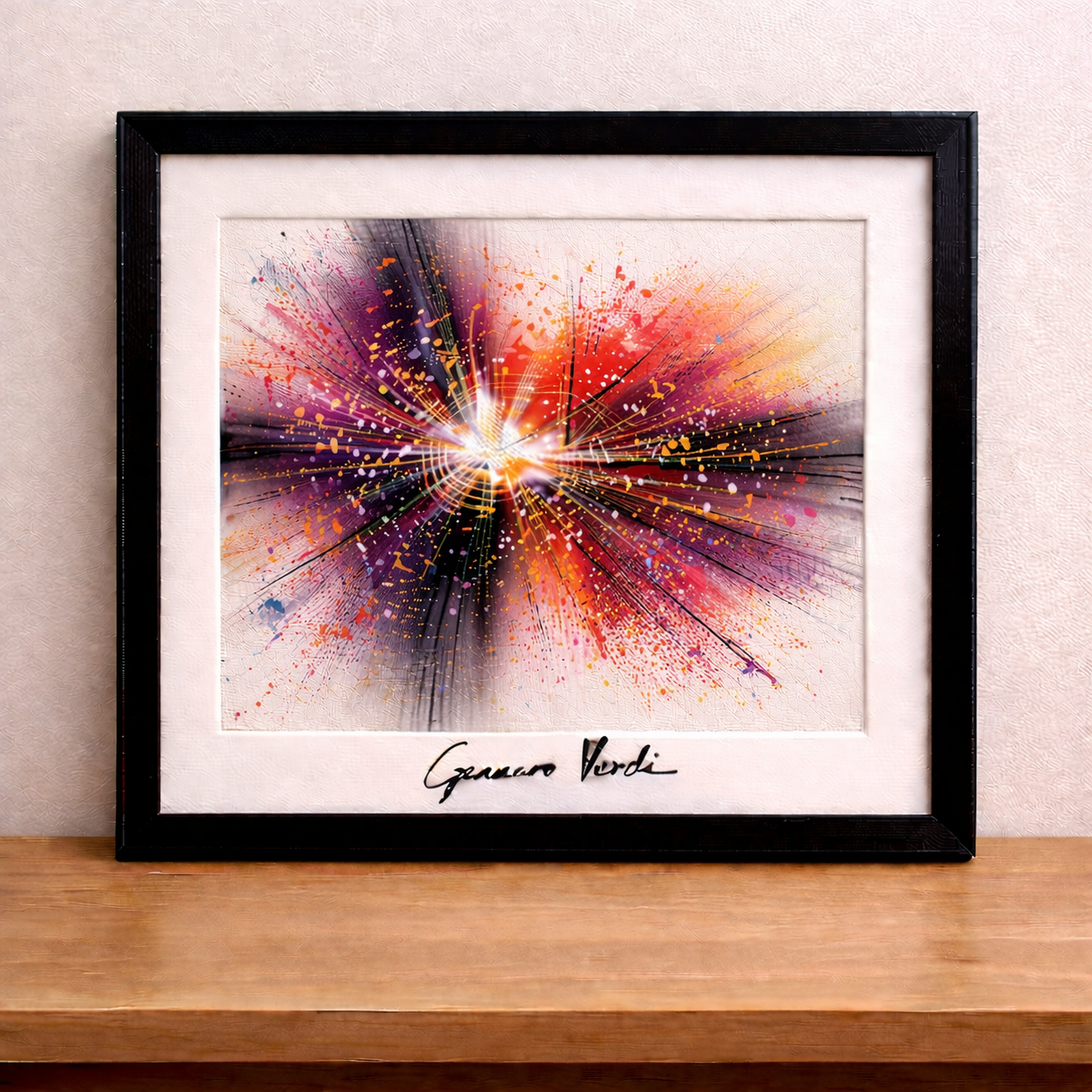 Framed abstract painting on wooden table